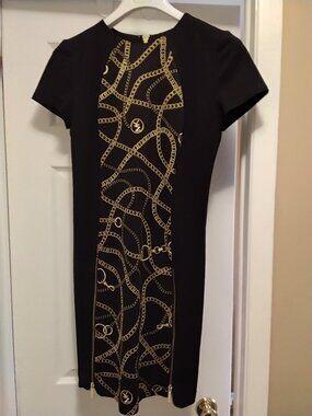 Michael kors designer dress  new getting small size 4